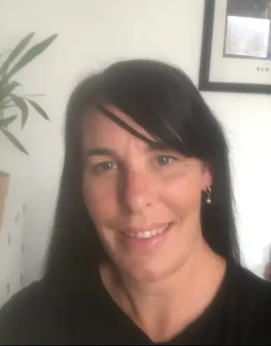 Portrait of Daniella Walsh, a BACP-registered counsellor, sitting in her office, surrounded by a warm and welcoming therapy environment.